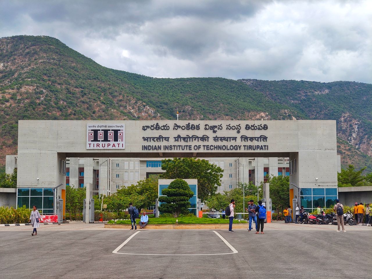 Main entrance of Indian Institute of Technology Tirupati with scenic mountains in background.